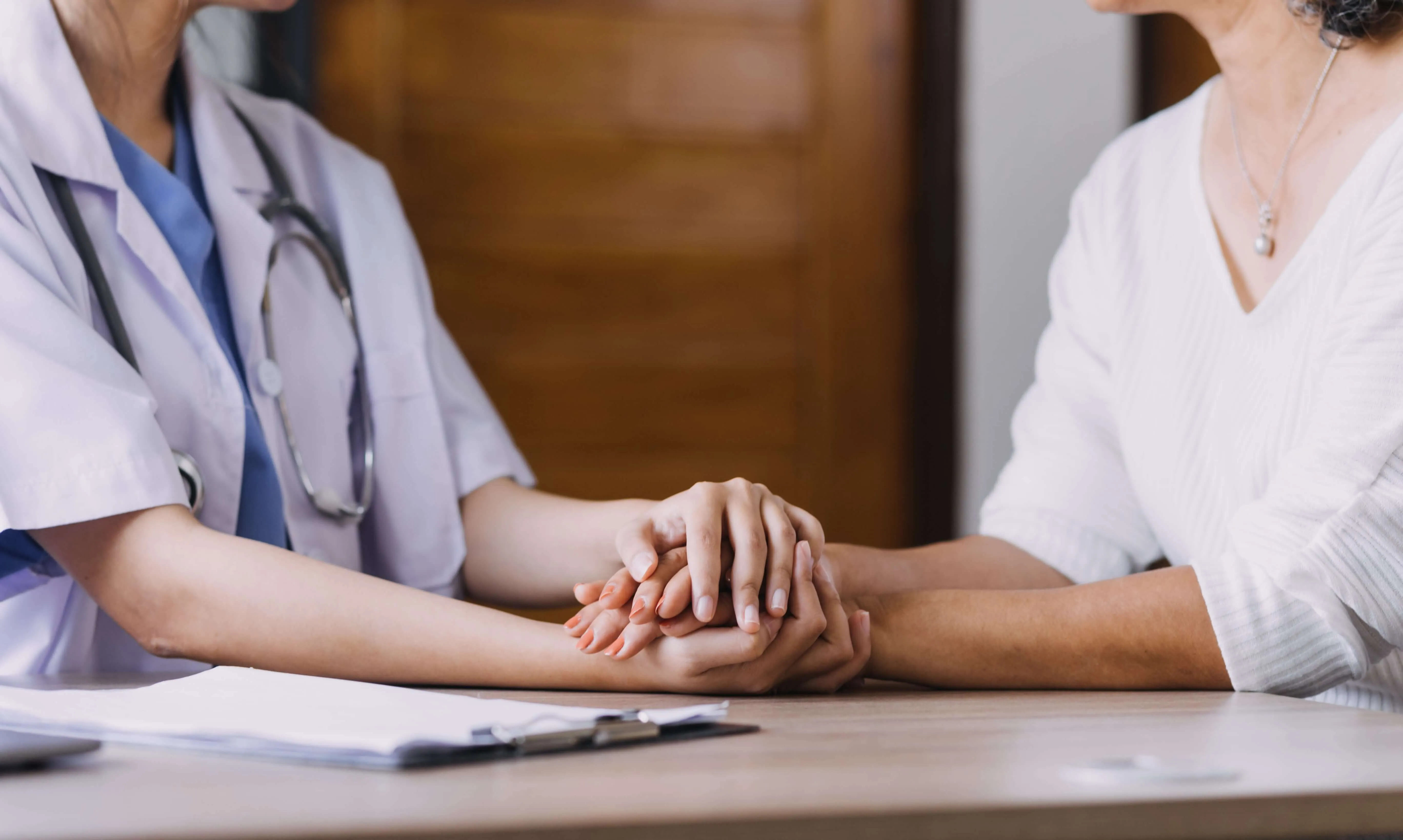 A reassuring doctor with a patient